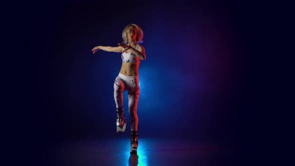 Lovely Female in Sports Suit Jumping in Kangoo Jumps Shoes. alt