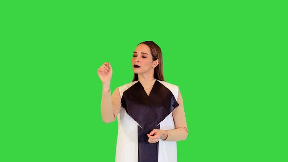 Robotic Girl Stands Pushing Virtual Buttons on a Green Screen Chroma Key