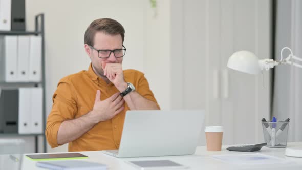 Young Man Coughing in Office  alt