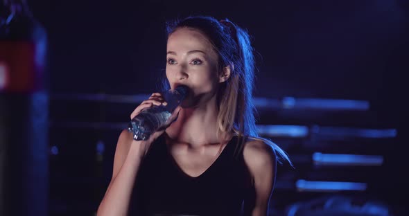 Attractive Female Athlete In Sportswear At Gym alt