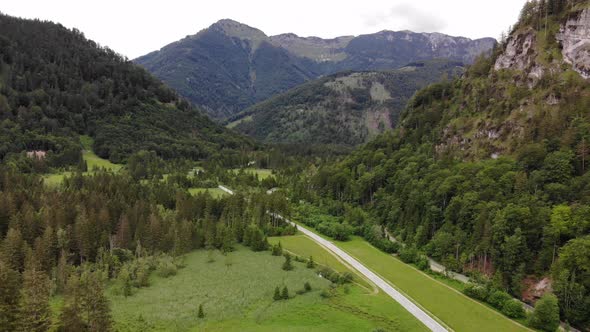 Beautiful Landscape with Mountains, forest and a Road alt