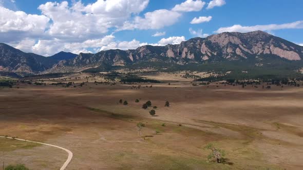 Flatirons and clouds in Colorado alt