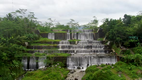 Aerial flyback at Watu Purbo waterfall in Muntilan, Indonesia alt