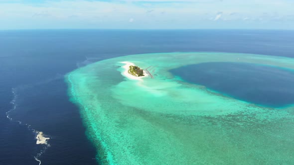 Aerial: Flying over idyllic atoll, scenic travel destination in Wakatobi Nationa alt