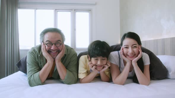 cheerful asian family lovely, children and home concept