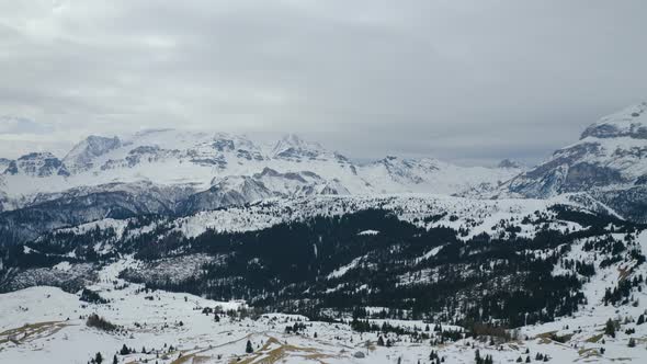 Aerial, Beautiful View On Snowy Dolomites Mountains, On A Cloudy Day In Italy