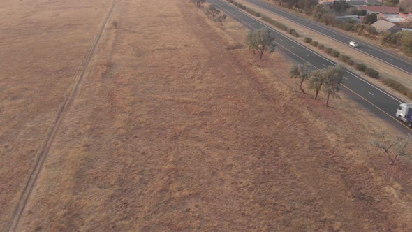 AERIAL shot over a busy national road alt