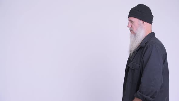 Profile View of Mature Bearded Hipster Man alt