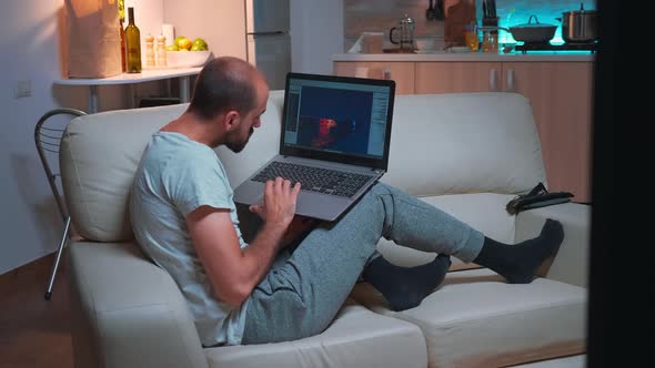 Professional Game Developer Working on Gameplay and Game Level Late at Night alt