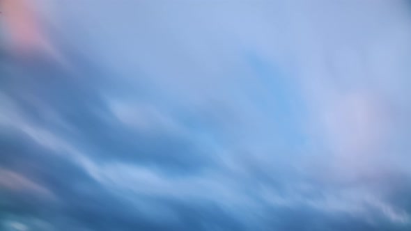 Long Exposure Timelapse Colorful Clouds Moving Fast and Blurred alt