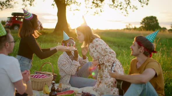 Multiethnic Friends Celebrate Birthday Party on Picnic in the Parc in Summer