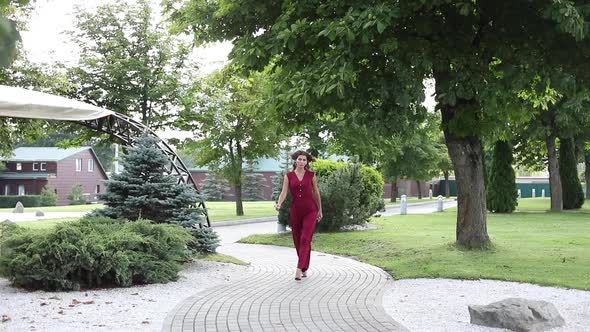 Beautiful Lady Smiling and Looking at the Camera Outdoors