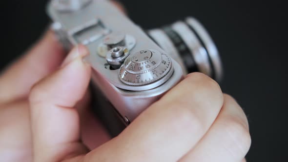 Close up Photographer Prepares Vintage Film Camera and Press the Button.