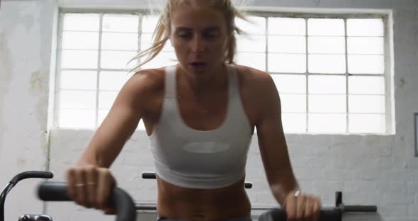 Front view of an athletic Caucasian woman exercising alt
