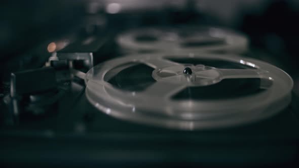 Vintage Tape Recorder Roller. Reel Film Tape Is Rotating at a Vintage Professional Player. Oldschool alt