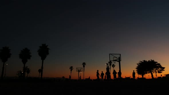 Players on Basketball Court Playing Basket Ball Game Sunset Beach California