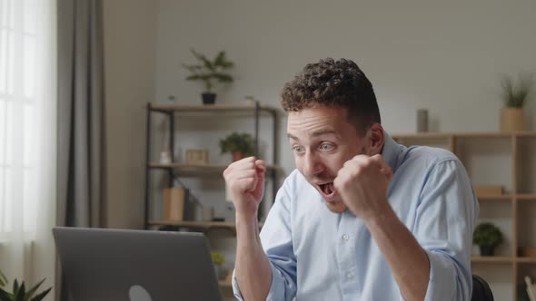 Attractive Man Celebrate Unbelievable Notice Read on Laptop alt