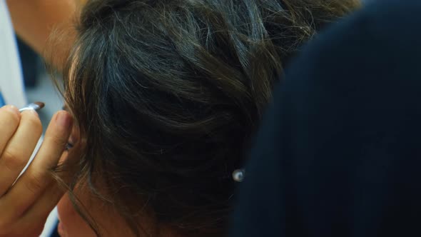 Hairstyling with Hair Spray Preparation for Prom alt