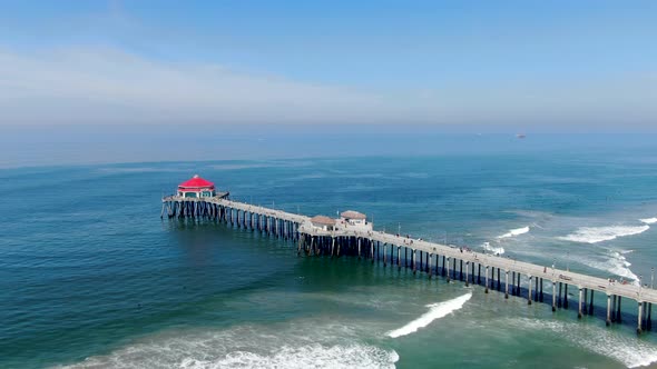 Aerial View of Huntington Pier, Beach and Coastline During Sunny Summer Day alt