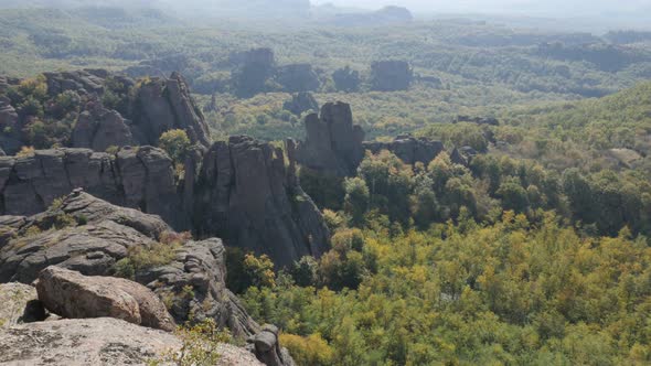 Valley with stone formations in Western Bulgaria slow tilt 4K 2160p 30fps UltraHD footage - Strange  alt