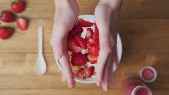 Strawberries Falling in a Bowl of Yogurt with Granola alt