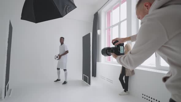 A Sporty Black Male Model Poses for Advertising Posters alt