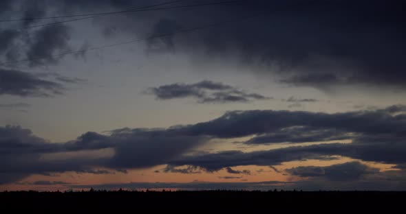 Time Lapse Of Fast Moving Dramatic Clouds On Sky At Sunset