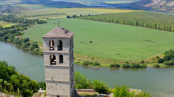 Landscape rocks and historic view. Aerial view of monastery on high steep rock alt