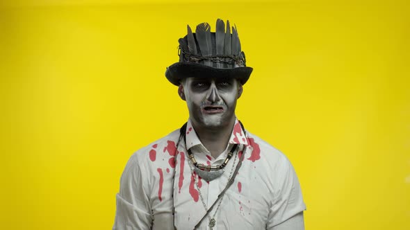 Creepy Man with Horrible Halloween Skeleton Makeup Looking Disappointed, Upset, Sad and Crying alt