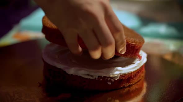 A Boy Smears A Biscuit Cake With Milk Cream. Family Weekend. Cake Cream. Culinary Preparation alt