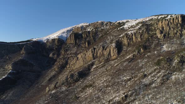 Aerial of snow covered hills alt