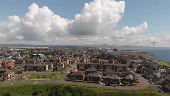 Panoramic view over Buckhaven on the Fife coast Scotland with massive wind generator in the energy p alt