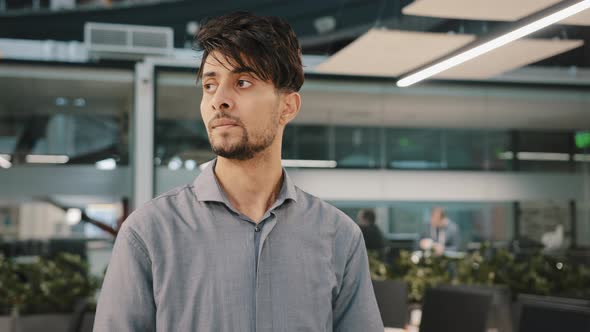 Portrait of Impatient Arab Man Leader Boss Waiting for Negotiation Meeting in Office Looking at alt