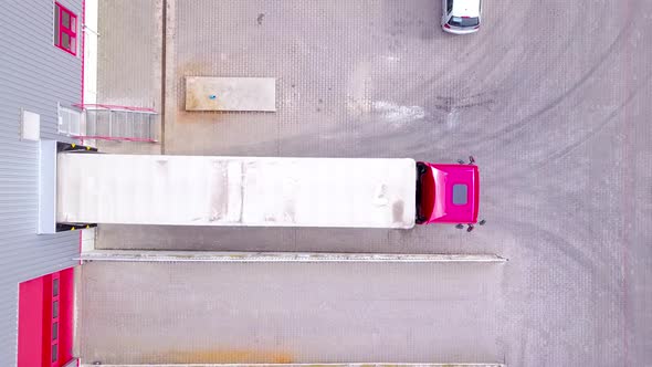 Truck is Driving to Logistics Center. Aerial Shot./ Storage Building/ Loading/ Unloading Merchandise alt