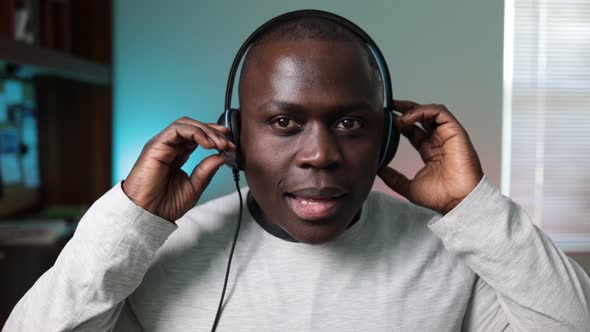 African American man putting on headset for a gaming video livestream. livestreamp5brief alt