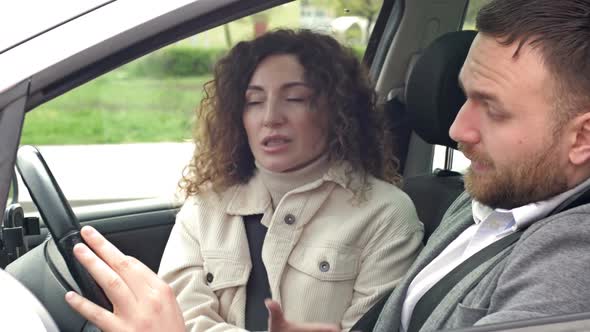 Man and Woman Emotionally Sort Things Out While Sitting in Their Car