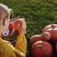Rear View A Child Paints a Pumpkin Prepares Decorations for Halloween - VideoHive Item for Sale