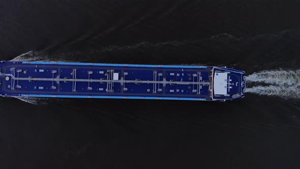 Liquid Cargo Barge Leaving Backwash In The Water. - aerial alt