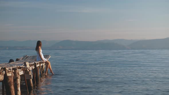 Young Woman On A Pier  alt