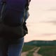 Active Healthy Caucasian Woman with Backpack is Walking Towards a Distant Mountain - VideoHive Item for Sale