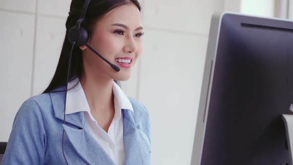 Customer Support Agent or Call Center with Headset Talking to Customer on Phone alt