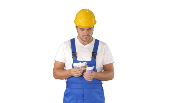 Builder Counting Money Standing on White Background alt