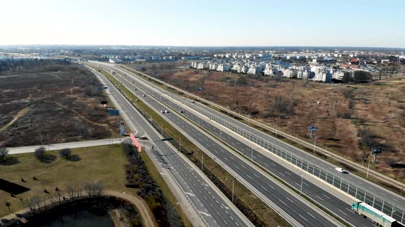 From Above of Modern Multi Lane Roadway with Car Traffic in Contemporary Megalopolis in Sunny Autumn