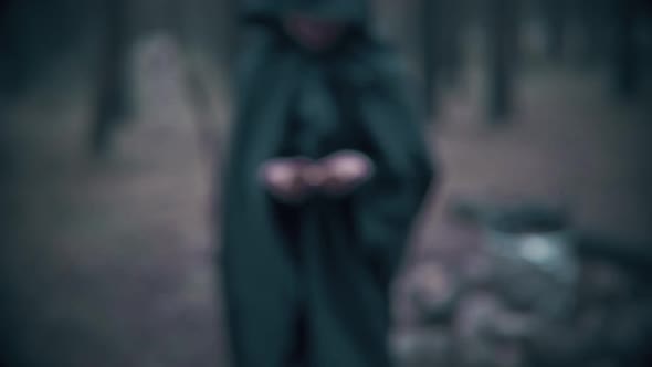 Terrible dark figure in the forest brings the key. Scene for Halloween