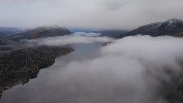 Flying Above the Clouds on Teletskoye Lake in Altai Mountains, Siberia, Russia