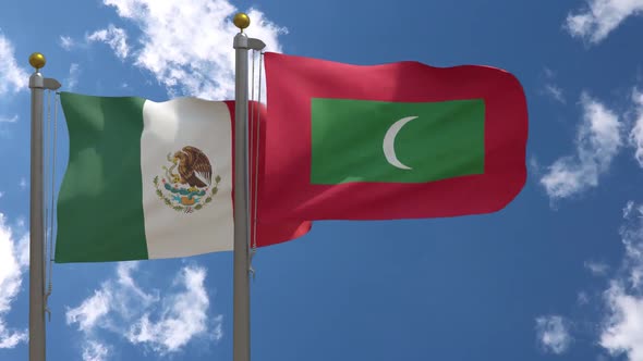 Mexico Flag Vs Maldives Flag On Flagpole alt