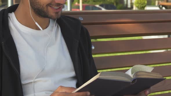 The Handsome Man Turns Over the Pages and Reads the Book alt