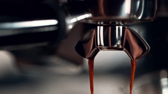 Super Slow Motion Detail Shot of Coffee Machine Pouring Espresso at 1000Fps alt
