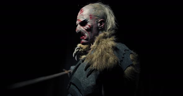 Scary Realistic Orc Is Putting the Sword on His Shoulder,  alt