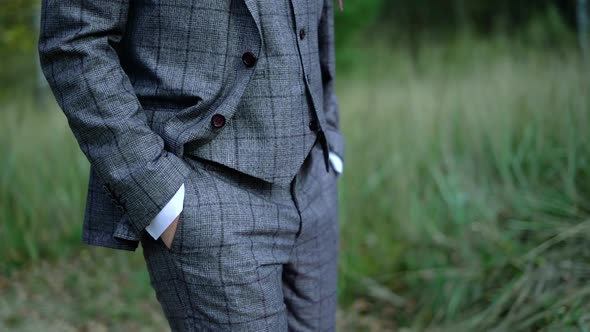  close-up of a man in a stylish suit without a face